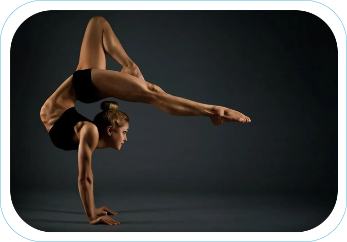 A woman doing a handstand pose in the air.